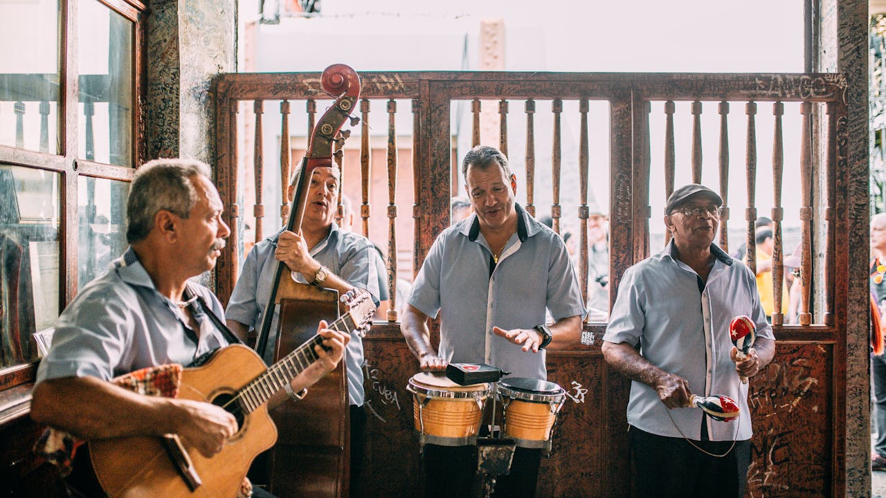 A lively band of musicians performing indoors with various instruments, creating a vibrant atmosphere.